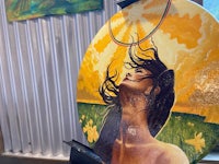 a painting of a woman with her hair blowing in the wind