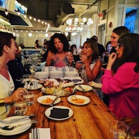 a group of people sitting around a table